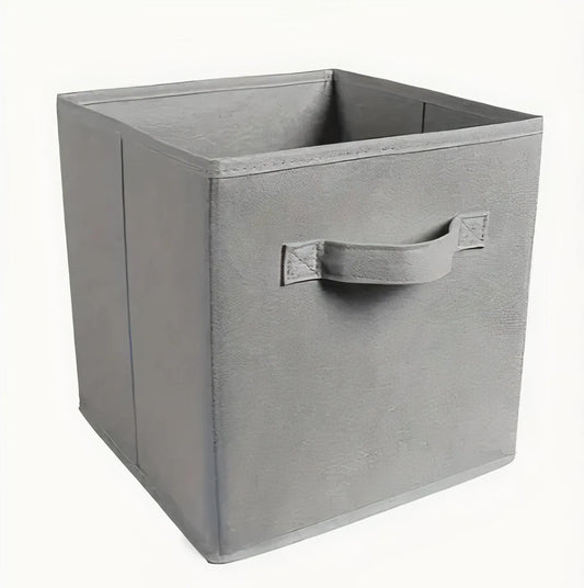 Gray storage cube with a handle on a white background