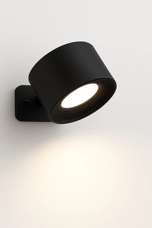 Black wall-mounted light fixture on a white background