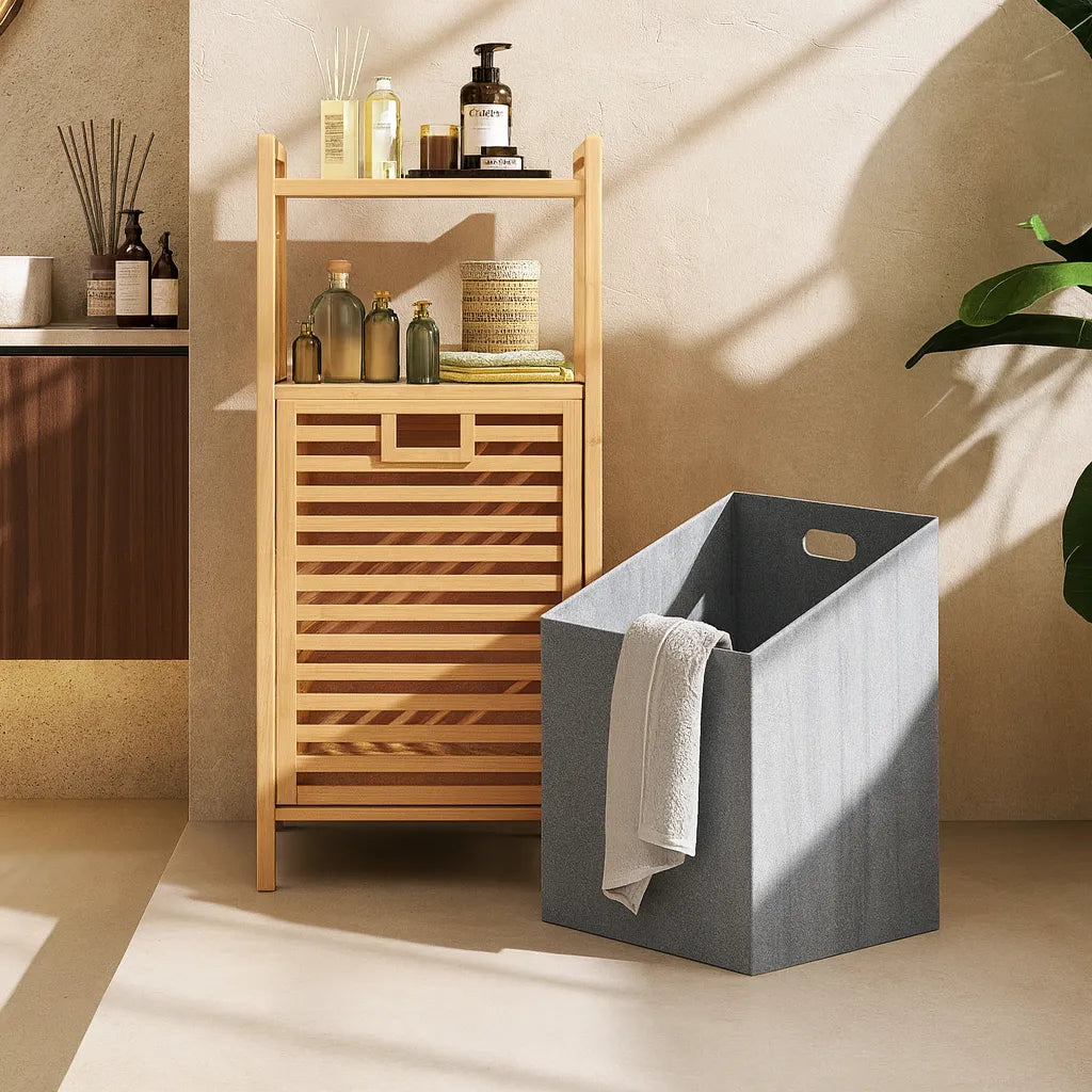 Gray laundry basket with a wooden shelf in a bathroom setting